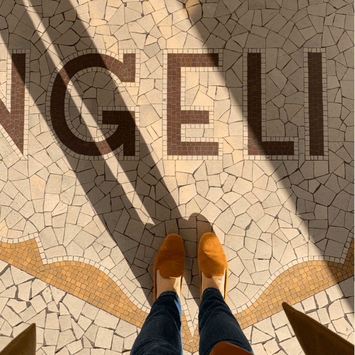 at the tiled floor outside Angelina Cafe